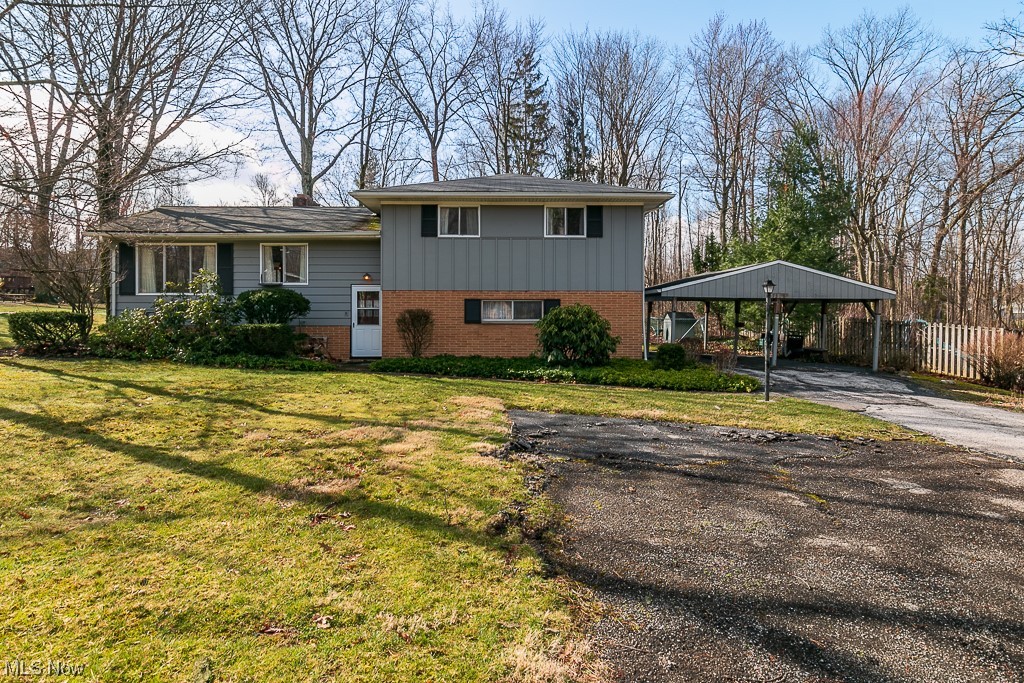 Charming Bi level home in desirable location of Kirtland. The home features 3 bedrooms and a 4 season room with plenty of windows. 2 car Garage being used as living space can easily be turned into a Great Room. Crawl space area for additional storage. Home is being sold AS IS.