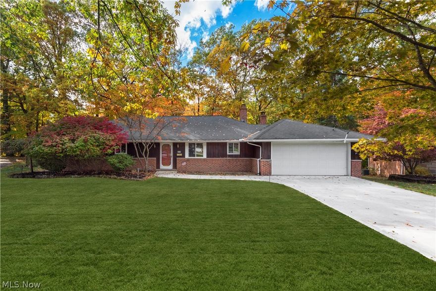 Welcome home to this large sprawling ranch on a quiet cul de sac.  The first thing you will notice as you pull in is the entirely new concrete driveway and walkway.  A recent roof, all new sparkling white vinyl windows and refinished deck complete the exterior. The warm and inviting foyer seems to welcome you into the home. A fresh coat of paint on everything from top to bottom throughout the entire home is very bright and homey. Imagine yourself relaxing in the great room with soaring vaulted ceilings or cozy family room while taking in the breathtaking views of fall out of the sliding glass doors located in both rooms. Or grab a cup of coffee and cozy up to the fireplace in the family room.  The home also boasts granite countertops, stainless range and subway backsplash in the kitchen with all new wood look flooring throughout the main living area, 1/2 bath and kitchen.  New ceramic tile flooring as well as updated vanities have been installed in the full bathrooms. Carpeting through
