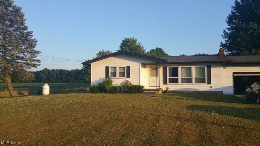 Ranch on 5 acres, 4 parcels with city utilities. Hardwood floors under carpet. Vinyl siding and windows plus glass block in basement. Furnace, A/C and electric updated 10 years ago, roof approx 2003, brand new hot water tank and kitchen stove. 2 car attached garage plus pole barn with overhead door and 220 electric fits 3 cars. Inground pool with new liner and all fenced in.