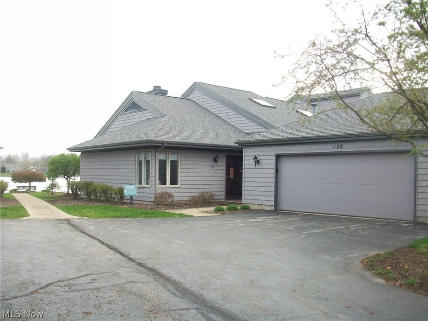 Fabulous lake front condo with 2 large bedrooms, 2 full baths and breathtaking view of the lake. Lots of storage, master bath remodeled last year. Updates include furnace and central air (2015), carpeting (2014), new roof & gutters (2012), siding (2010), new engineered hardwood walnut floors (2011). Heated garage with extra storage. All appliances stay - newer GE Adora.