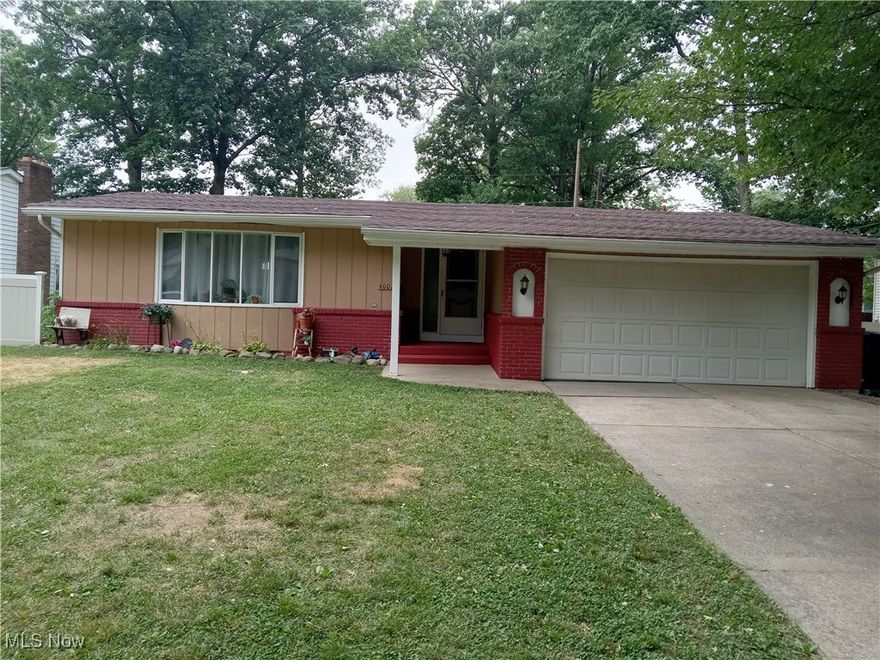 Lease-to-own option! Welcome to 4002 Washington Avenue, a beautifully remodeled ranch-style home nestled in the peaceful West Lorain neighborhood. This 3-bedroom, 2-bathroom residence offers 1,576 square feet of updated living space on a spacious 0.3-acre lot. Inside, the open-concept layout is anchored by a cozy fireplace and flows seamlessly through the living, dining, and kitchen areas. The kitchen is a true showpiece, featuring solid wood soft-close cabinetry, concrete countertops, stainless steel Whirlpool appliances, and gorgeous hardwood floors that extend throughout the main living spaces. The bedrooms are comfortably carpeted, while both full bathrooms have been tastefully upgraded with quality tile work. French sliding doors lead from the family room and dining area to a large backyard—ideal for outdoor entertaining or relaxing in nature. The property backs to a wooded area, offering a serene view and a touch of wildlife just across the street. The home includes central HVAC, gas heat, and an attached two-car garage with plenty of driveway space. Located near local schools, shopping, and highways, this move-in-ready home offers style, space, and comfort in one of Lorain’s most established neighborhoods.