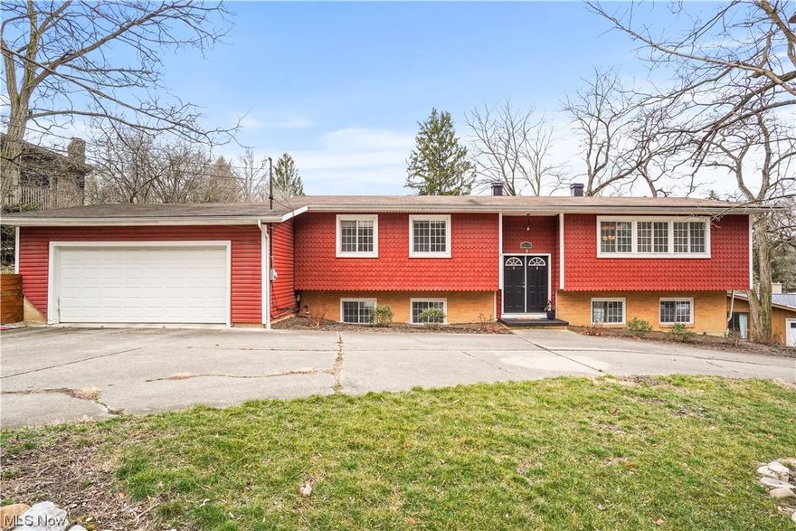 Wonderful home and property present an open floor plan and is conveniently located directly across from the metro park. This bi-level style home presents numerous updates and improvements with newer luxury vinyl floors throughout much of the first floor.  Bright formal living room features a wall of windows and overlooks the formal dining room with sliders to balcony deck.  The kitchen offers all amenities including SS appliances, maple cabinetry, tile backsplash, tile flooring, and chair rail.  The main hall leads to three spacious bedrooms and a nicely updated full bath w/access to the master bedroom.  The master bedroom is complete with two closets, one of which is a large walk-in w/vanity.  The expansive lower level highlights two separate living areas. On one side is the family room featuring a wet bar w/beverage frig and newer butcher block counter. The opposite side boasts an updated full bath and an office/exercise/multi-purpose room and sliders to the outdoor patio.  Large yard w/firepit.  Two car garage. Circular drive.  Notable amenities include addition of retaining wall, french drain, rebuilt stairs to garage, new carpet in LL.  HVAC ('17), water heater ('16), DW ('18).  Close proximity to shopping, parks, and cultural opportunities.