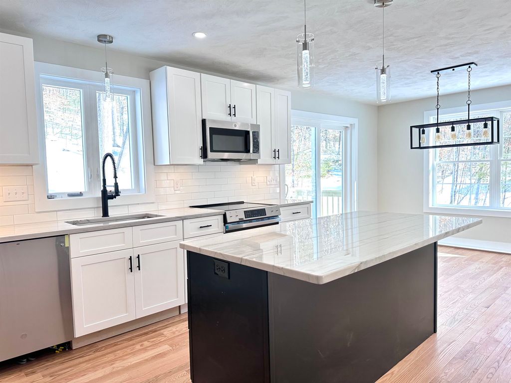 Photo of 12 Peaslee Road, Rochester, NH 03867 (MLS # 5074642)