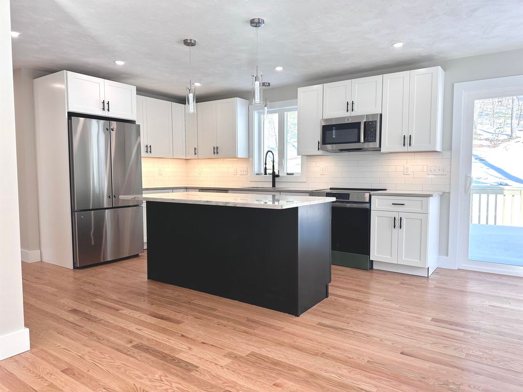 Photo of 12 Peaslee Road, Rochester, NH 03867 (MLS # 5074642)