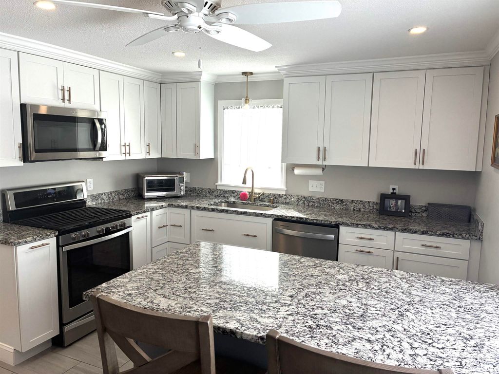 Photo of 90 Tarbell Street, Manchester, NH 03104 (MLS # 5077414)