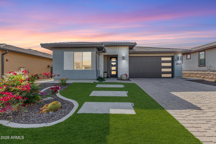 Welcome to your dream home with stunning Four Peaks Views at Trilogy at Verde River--a beautifully upgraded Acacia residence showcasing timeless curb appeal with a two-car garage, elegant paver drive, new fencing, and manicured artificial turf. Inside, the airy Great Room is filled with natural light featuring a designer palette, a custom feature wall, and upgraded wood-look flooring. Designed for both entertaining and everyday comfort, the chef's kitchen features quartz countertops, a reverse-osmosis system, white shaker cabinetry with crown molding, designer tile backsplash, pendant and recessed lighting, stainless steel appliances, a custom walk-in pantry, and an oversized island with breakfast bar seating. A versatile den is ideal for a home office or study. The spacious primary suite offers a spa-inspired bath with dual vanities and a walk-in closet. Outdoors, enjoy a covered patio and ramada, a renovated built-in BBQ, and captivating Four Peaks views. Additional upgrades include a water softener, automatic irrigation front and back and custom landscaping.
