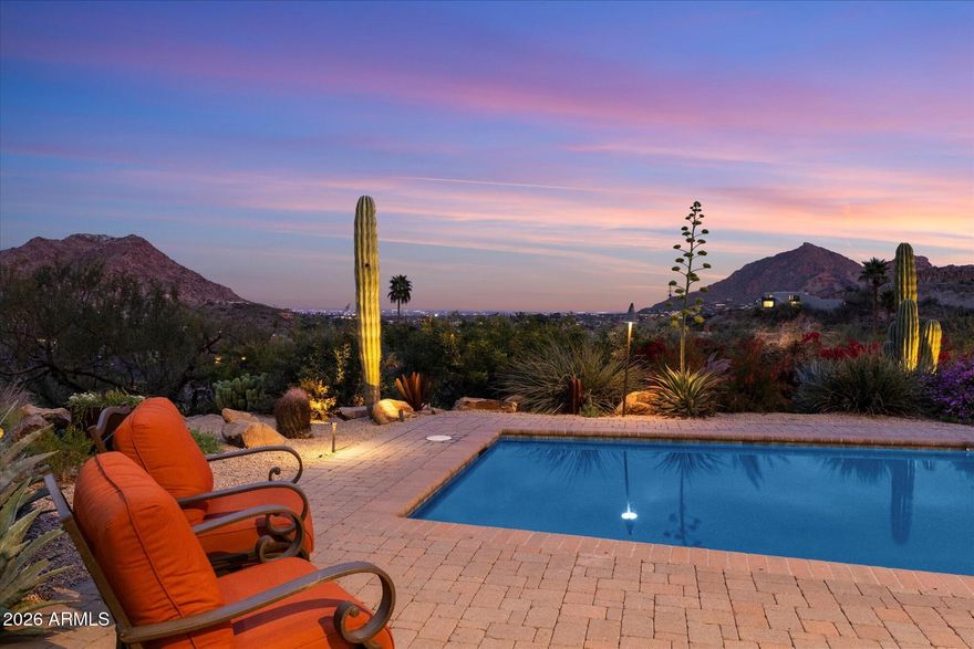 Located in the sought after guard-gated community of Clearwater Hills with beautifully curated landscaping and exceptional panoramic views, this home captures the essence of upscale living in Paradise Valley. This one acre, single level, mountainside home offers a floor plan featuring generous living and entertaining spaces, ideal for both everyday living and hosting guests. The split floor plan hosts a primary suite retreat with a newly remodeled bathroom designed with dual vanities, lit defrosting mirrors and a wet room with dual shower heads and soaking tub. Each of the generously sized additional bedrooms include newly remodeled en suites. The chef's kitchen is well equipped with Viking and Wolf appliances, additional buffet cabinetry with an ice machine and beverage refrigerators.