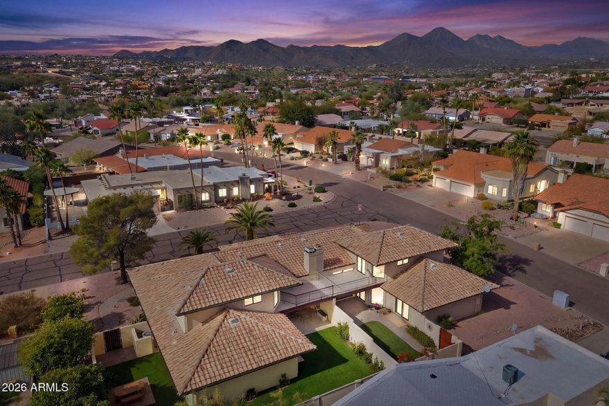 Situated on a corner lot, this open-concept twin home features panoramic mountain views & soaring vaulted ceilings. The spacious Great Room flows seamlessly with wood-look tile flooring, cozy fireplace & abundant natural light. The chef's kitchen offers stainless steel
appliances, quartz counters & breakfast bar for casual dining. The main floor features an expansive primary suite with spa-like bath complete w/ dual vanities, soaking tub, separate glass shower & walk-in closet. Step outside to a private, low-maintenance courtyard with artificial turf, pavers & covered patio. The flexible layout includes a second main floor bedroom (ideal for a home office) & bath. The upstairs loft is a perfect media room & includes a full bath. The rare rooftop deck and offer incredible sunset views. Complete with a large laundry
room and 2-car garage, this home is move-in ready.