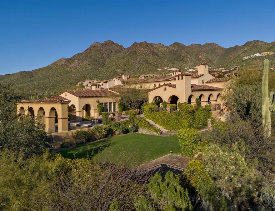 Celebrate the good life in this spectacular custom sanctuary boasting city light views, exceptional sunsets and pristine mountain vistas in every direction. Privacy is the cornerstone of this home, tucked away on 2 generous acres backing to the preserve in the Upper Canyon, in the prestigious community of Silverleaf. This single story, split floor-plan house is the 'right size' at just under 5700 square feet. It is light and bright and captures the very essence of desert living with generous indoor & outdoor venues for entertaining or relaxing. Luxurious finishes and superior craftsmanship raise the standard of the property by featuring an extensive use of hardwood floors, hand hewn wood beams, custom cabinetry, and superior brick, stone and metal craftsmanship. A spectacular gourmet kitchen anchors the home and is designed for easy entertaining, with a center island, custom cabinetry, and the high-end appliances one would expect in a home of this caliber. 
 
The generous master retreat is luxurious and split from the two en-suite bedrooms. Oversized windows capture light and views, and the bath and closet space compliment the space perfectly.
 
 
The executive office makes working from home a joy, while the theatre room is on point for entertaining and movie night. There is little room for excuses, with easy access to a personal in-house gym. And family and friends will delight in the private guest casita, located upstairs, with access from the main home as well as the front courtyard. The casita includes a bedroom, bath, sitting area with kitchenette and balcony with stellar views of the McDowell Mountains. 
 
Outdoor living at its best, with a pool and spa that overlook a mountain through an arched decorative wall. An outdoor dining area complete with BBQ, fireplace and TV, plus a center plaza and an event lawn with in ground trampoline, provide plenty of space for larger outdoor events. 
 
The 4 car garage has epoxy flooring and enjoys lots of storage space with custom cabinetry and extra room for toys. This home has it all and is not to be missed!
 
*Silverleaf residents enjoy amenities such as guard gated entry, roving security, hiking trials, walking baths, community centers with fitness, lap pool, spa, (2) lighted tennis courts as well as basketball courts and children's park. There are also (2) country clubs with golf and social memberships available: Silverleaf Country Club and DC Ranch Country Club.