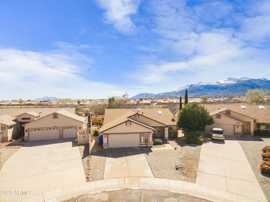 Views, views, and more views! Don't walk, run, to this beautiful open floor plan four bedroom home in a highly desired neighborhood! 4th Bedroom would work as a fantastic home office.  Two living areas OR 
 perfect sized living room plus enormous eat in kitchen/entertaining space! Perfectly placed in a cul de sac with no neighbors behind you. Extra large back yard with unbeatable view of the Huachuca Mountains!