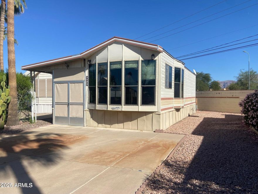 Own the land in this 55+ golf course resort. Here is your chance to own a winter home in great condition at a small price! This older unit will impress! There is a long list of upgrades that include a new AC/heat in 2025, 2024 new roof, rebuilt kitchen including new appliances, solid surface flooring throughout. Over the top bathroom renovation including a spacious walk-in shower. New water heater in 2019. Recently added sunscreens surround a large Arizona room with attached shed/laundry. Comes with a termite warranty and all documentation for the work that has been done. Turn-key!
