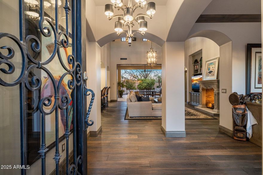 Welcome to your dream home, crafted by the renowned Cullum Homes, nestled in the prestigious guard-gated community of Paradise Reserves. This stunning residence is perfectly positioned on the hillside of the Phoenix Mountain Preserve, offering unparalleled privacy and breathtaking views. The great room features a wall of pocketing doors, seamlessly blending indoor and outdoor spaces for the ultimate Arizona lifestyle. Enjoy the privacy of a split master suite and two guest suites, each with their own en-suite bath. 

Outdoors your private oasis, offering stunning views of Camelback Mountain.
This home is a masterpiece of design and functionality, offering the perfect blend of luxury and comfort. Experience the best of Arizona living in this exclusive Paradise Reserves residence.