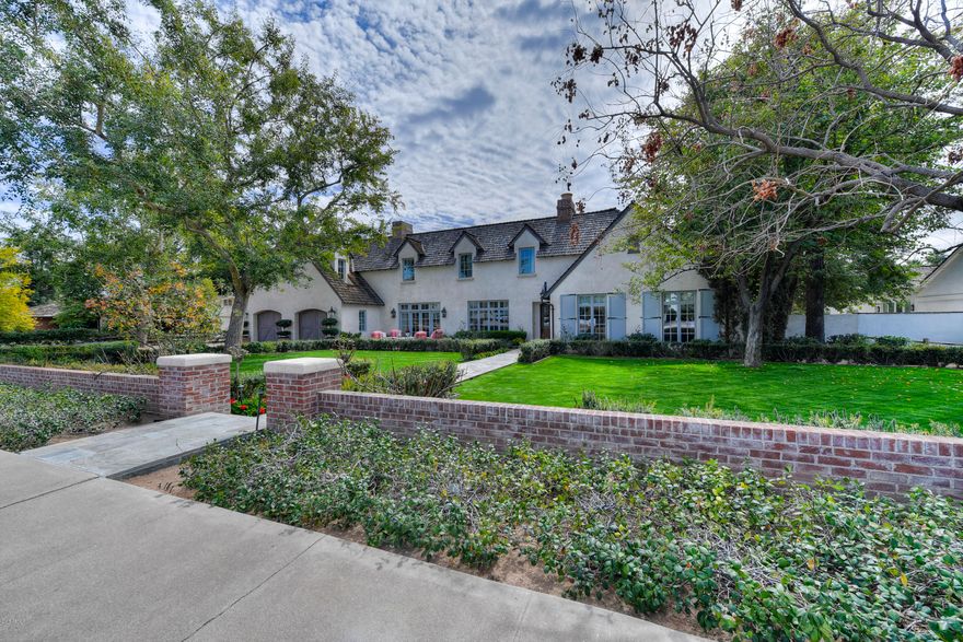 Inspired by the European Villas of France and Italy, this charming yet sophisticated estate has long been one of the most beloved properties in all of Arcadia. Wonderful combination of gracious living spaces include 5 bedrooms, 5.5 baths plus an extra bonus/family room with separate access to one of the most posh pools and backyards you can imagine. Master suite includes an office with custom cabinetry and sitting room with fireplace and incredible views of Camelback Mtn. Situated on a generous N/S Facing 24,000 SF Lot with sprawling lawns and abundant gardens by Berghoff Design, on one of the most desirable streets in the neighborhood.Designed by Candelaria and built by Nance Co. this property was completely built new from the ground up in 2005 and recently updated with chic finishes and fixtures by Vallone Design. Featured in an International Design Magazine, this truly exceptional property has been meticulously maintained by the owners. 
Call for more details or to schedule a showing.