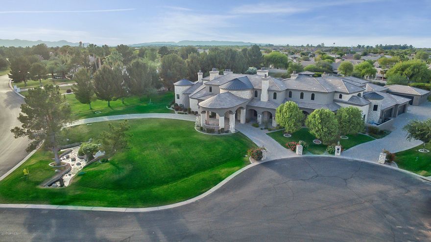 HUGE PRICE REDUCTION!! Stunning home on a sprawling cul-de-sac corner lot. This home boasts lake front views, with a sprawling lush green landscape and drive through driveway. With over 11000 sf of living space this home offers a grand double stair foyer, gourmet kitchen complete with over-sized island and viking appliances, multiple fireplaces, 8-car garage, fitness room, plus a private basement with kitchen, wine cellar, billiard room and movie theater. Relax in the ultra private master suite separate from the rest of the home, with a spacious bedroom, separate sitting room w/ fireplace, walk-in closet with plenty of custom shelf's, and a one of a kind master bathroom with large tub, walk-in shower and fireplace. Entertain in the large backyard, complete with outdoor fireplace, grill station, 150+ feet of covered patio space overlooking lush green landscape and sparkling blue pool w/ Jacuzzi. Too many upgrades to list!! This home is a must see to believe, contact us today.