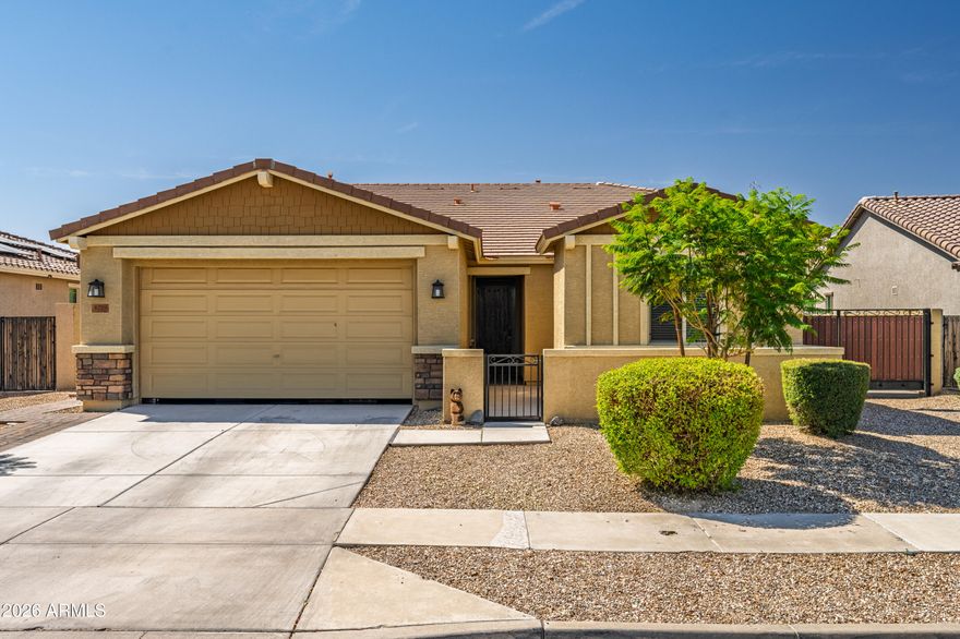 Beautiful 4 bedroom, 2.5 bath with a 3 car tandem garage and RV gate and slab featuring an expansive great room and dining area. Perfectly situated on a desirable north/south-facing homesite, the spacious covered patio offers an ideal setting for outdoor relaxation and gatherings. Gorgeous granite countertops accented by a custom tile backsplash, painted linen cabinets, and premium stainless steel gas appliances. Stylish 20'' x 20'' custom tile flooring flows throughout the main living areas, while the primary bath features a beautifully tiled walk-in shower with an impressive 7-foot shower head, creating a spa-inspired retreat.