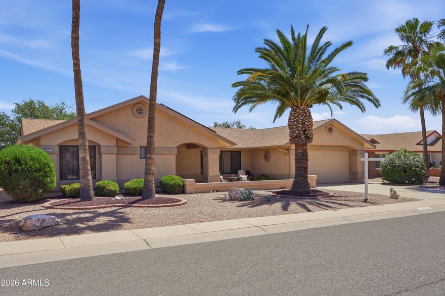 Experience the Sun City West lifestyle in this well-kept 2 bedroom, 2 bathroom home featuring an open, inviting layout and vaulted ceilings that create a bright and spacious feel. The expansive back patio is a true highlight... perfect for outdoor entertaining, relaxing mornings, or enjoying Arizona's year-round sunshine. Inside, the functional floor plan offers comfortable living and easy flow, ideal for both everyday use and hosting guests. Complete with a 2-car garage and low-maintenance landscaping, this home combines convenience with charm. Residents enjoy access to world-class community amenities including golf, pools, fitness centers, and a wide variety of social activities.
