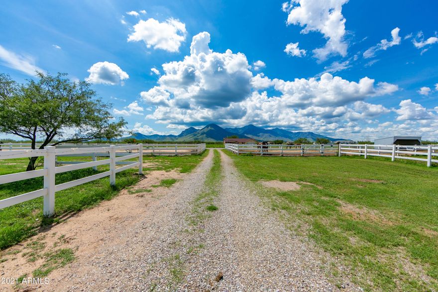 Saddle up and ride on over this gorgeous ranch. Sitting on over 10 acres  it is ready for you and your animals. The humans home is over 1900 square feet manufactured home with 2 covered patios and a covered porch perfect to look out to the unobstructed mountain views. The home is 3 large bedrooms and 2 bathrooms open living space including the spacious kitchen, dining area and family room. Step out side to the 8 horse stall, barn, shed, round pen and so much more. Panels will stay with the property to allow for any configuration you need for your animals. Everything you need to call it home. This is an opportunity that will not last!