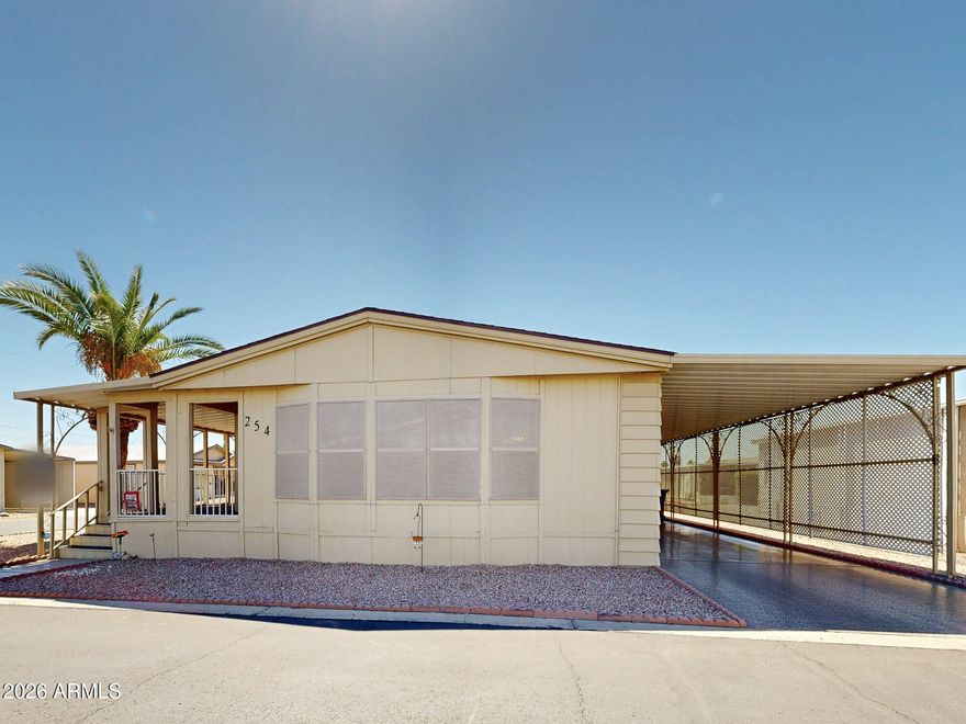 This VERY SPACIOUS HOME ! Is BEAUTIFUL! with A HUGE STORAGE ROOM  that could be used for many hobbies or Craft workshop! with a closed In Arizona Room/Enclosed Patio. Also a BUILT IN BAR! to entertain guests. Corner Lot, Vaulted Ceilings, and Large Kitchen! Located In a 55+Gated Community. Come see this well maintained home!