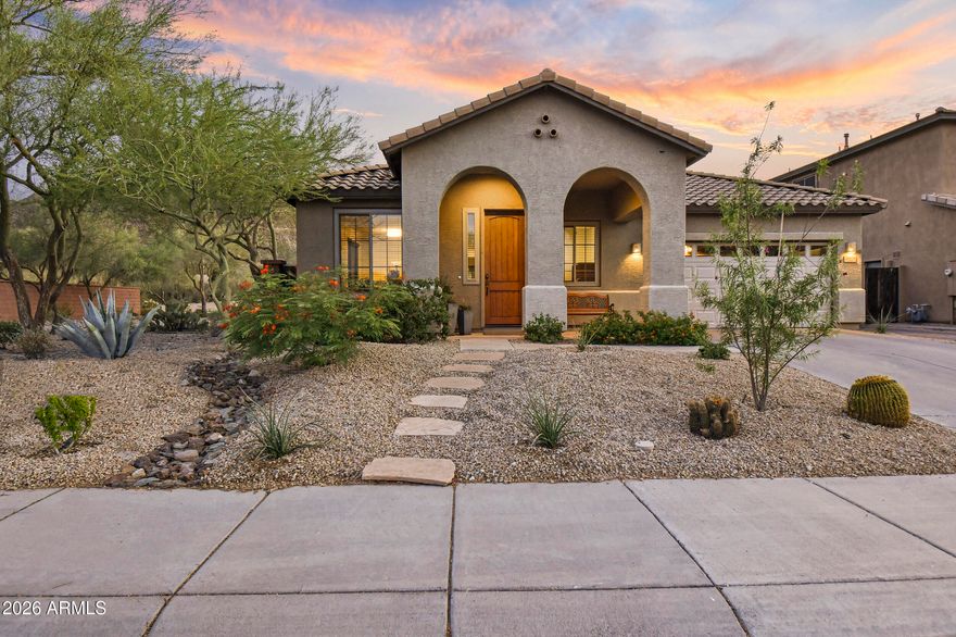 Experience the coveted WestWing lifestyle in this beautifully appointed home, where an airy open-concept design, abundant natural light, and a desirable split-primary layout create the perfect home. Designed for both everyday living and memorable entertaining, the backyard is a private retreat featuring a large play pool, sweeping mountain and sunset views, a covered patio with a built-in BBQ area, lush turf-all complemented by an enlarged RV gate with pavers for additional parking and a two-car garage with built-in cabinetry. Inside, the spacious primary offers French doors opening to the patio and a generous bath with dual sinks and a private water closet. The well-equipped kitchen showcases 42'' Cherry cabinets, a large granite peninsula, and built-in appliances flowing into the breakfast and family room spaces. A large office with an exterior-facing window and French doors to the great room adds versatility and style. You are within walking distance of parks, walking trails, an A+ K-8 school, a fantastic church and exceptional shopping and dining just minutes away. New HVAC 2022, new carpet & paint 2026, new Irr. valves with pvc piping, new garage door.
