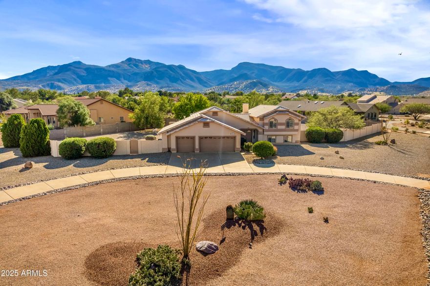 This beautiful 3-bedroom, 3-bath home has been refreshed and is ready to impress. With 2,917 sq ft of living space on an oversized corner lot, this property blends comfort, style, and Arizona outdoor living. Step inside to find fresh interior paint, new flooring, updated light fixtures, and renewed skylights that flood the home with natural light. The spacious kitchen features a granite island; the living area has a cozy fireplace and surround sound throughout the home—perfect for entertaining or relaxing. Outside, enjoy your own private retreat with a sparkling pool, putting green, outdoor kitchen, extended patio and mountain views. The paved circular driveway, 3-car garage, RV gate, and storage shed add everyday convenience and functionality.  All of this with no HOA!!!