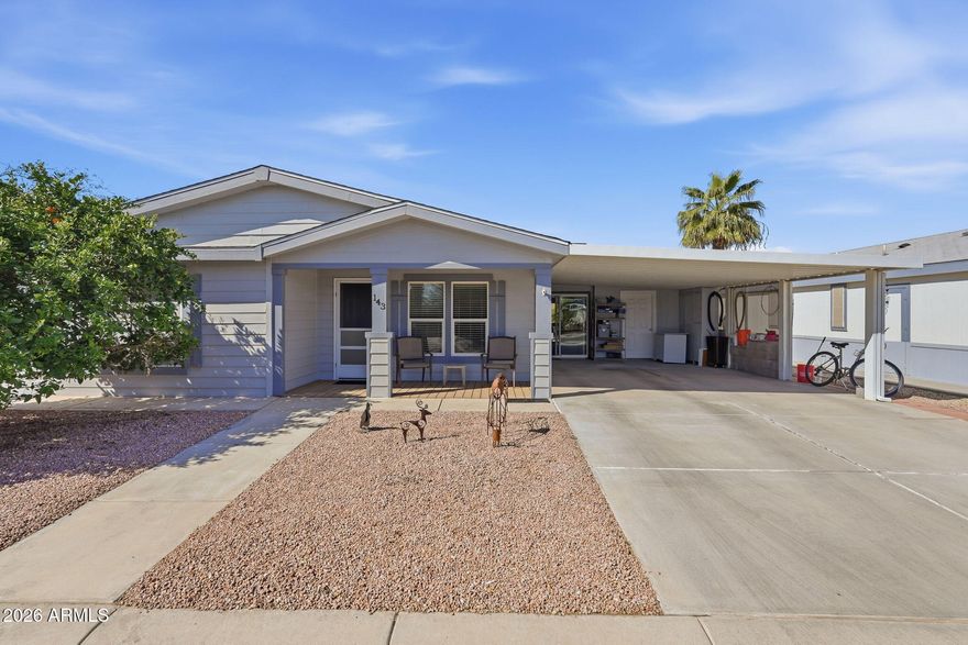 Welcome home to this charming corner-lot retreat where comfort, character, and community come together. A mature orange tree graces the front yard, offering natural shade over the inviting front porch which is the perfect place to enjoy your morning coffee, wave to neighbors, and truly feel at home.  Step inside and you'll immediately appreciate the vaulted ceilings that create an open, airy feel throughout the main living spaces. The spacious great room seamlessly blends the living and dining areas, making it ideal for entertaining friends or enjoying peaceful evenings at home.  You'll find two generously sized bedrooms and two full bathrooms, both featuring double vanities for added convenience and functionality. Ceiling fans in the bedrooms and great room enhance comfort year-round The kitchen offers an eat-in dining space along with a built-in desk and additional cabinetry for storage...perfect for staying organized, managing household details, or working on hobbies while staying connected to the heart of the home.  From the two-car carport, step into the enclosed patio, a cozy extension of the home that invites you to curl up with a book, host neighbors for game night, or simply relax in your own private retreat. The shed, currently used as a workshop, provides abundant storage and flexible workspace options.  Solar shades on the windows and roll down shades on the back patio.  Energy efficiency is already in place with solar panels there are 10 owned and 11 leased helping reduce utility costs. The recently replaced roof includes a transferable 30-year warranty, offering valuable peace of mind.  Located in an active 55+ community, residents enjoy an exceptional lifestyle with amenities including pickleball, shuffleboard, cornhole, a pool and spa, bowling, and so much more. Whether you're looking to stay active, socialize, or simply relax, this community offers something for everyone.  This is more than a home, it's a lifestyle designed for comfort, connection, and easy living.