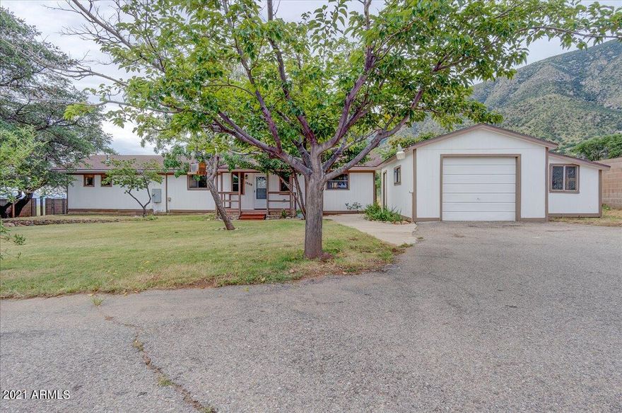 Beautiful Ranch Home w/Mountain Views-Completely Fenced w/custom gate! This 4 Bdrm 3 Ba Home features 2 large Primary (Master) Bedrooms-each w/Private bath. Soaring tongue in groove vaulted ceilings are sure to please. New built in LR bookcase. Kitchen features Granite countertops, brand new double oven in wall + separate reg stove w/another double oven, French Door refrigerator, Dishwasher & Microwave-all appliances remain.  Keep warm & cool  w/2 Separate HVAC units (1 brand new) + nice wood burning stove in LR. Covered back deck, Plenty of Parking, Storage Shed + 1 car garage.  All of this on ½ acre.  Other Updates include: New tank-less water heater, fresh interior & exterior paint and new carpet. Roof was replaced approximately 2018.  Move In Ready!