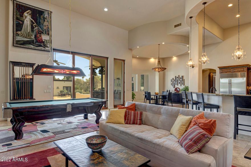 SPECTACULAR 6,500+ SF LUXURY ESTATE with over 1.1 Acres in the Cactus Corridor with NO HOA!!  This is a 5BD 7BA home designed with the finest of craftsmanship! The expansive floor plan has soaring 16ft ceilings, with huge gourmet kitchen, knotty alder cabinets, Brazilian granite that opens to a large family room and so much more. Enjoy your own home theater, personal library & two separate home offices. Designer touches include Cantera stone accents, oil rubbed bronze finishes, luxury appliances, and 10ft high solid wood doors that open to the backyard oasis with an outdoor kitchen, that includes multiple dining areas. The large pebble sheen pool & spa, and private detached guest casita with a large covered patio are great for extended family or entertaining out of town guests. The side yard boasts an RV Gate with plenty of room for your large toys and RV.   Close to A+ Schools, award winning Basis Schools, great shopping and dining and freeway access.  Do not wait on this fantastic opportunity to own this magnificent estate in a highly sought-after location!