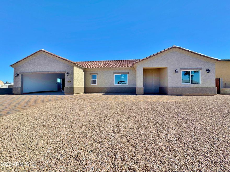 BRAND NEW!  You won't believe the upgrades in this 4 bedroom, 2 bath 1745 Sq. Ft. home with tile flooring throughout.  Spacious Kitchen with soft close drawers, Granite Counters, Stainless Steel Range, built in Microwave.  Great room with arcadia door opening up to oversized covered back patio with block privacy wall.  Split floorplan with large master suite, Tiled Shower, Double vanities and walk in closet with shelving.   Full 2nd bath with Tile surround and 3 other bedrooms or use 1 for an office!  Ceiling fans, recessed and pendant lighting throughout.  Indoor laundry with cabinets and granite work space.  Garage with remotes, fenced back yard with double gates on both sides.