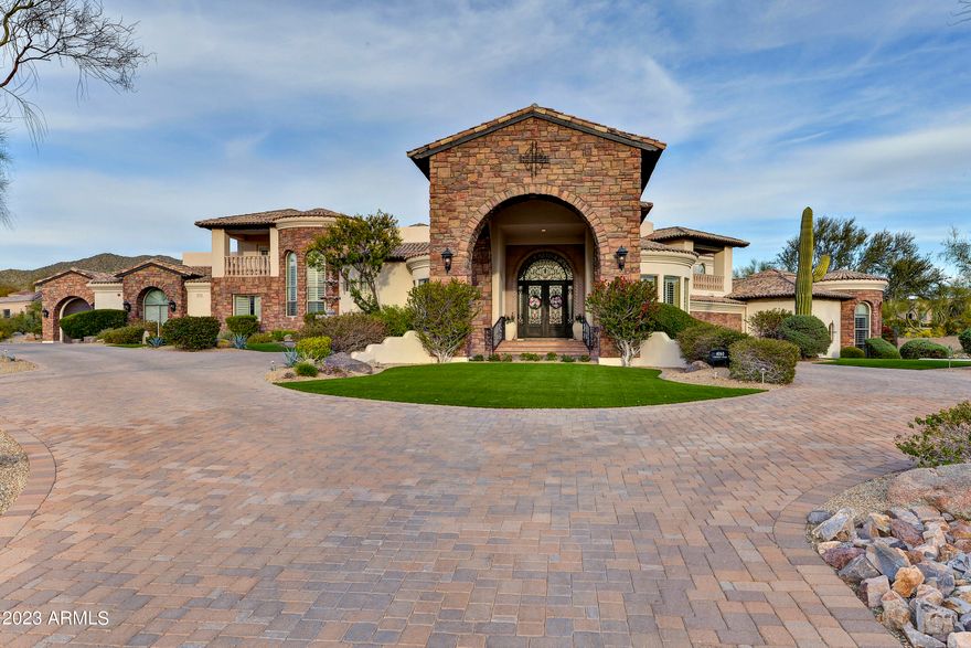 This WORLD CLASS ATHLETE'S HOME sits adjacent the Las Sendas Mtn. Golf Course in N.E. Mesa! This home boasts 7,919 SF. Total w/Casita. 1.83 acres at the end of cul-de-sac is incredibly private! Award winning designed space & MAIN FLOOR LIVING!*Butted Glass windows & doors view the tropical 5-Star resort-like grounds from kitchen/great room w/soaring ceilings*Walk out to over 2,200 s.f. of Covered Patio for entertaining!*Tee off from your own 5-hole golf course w/1,881 s.f. Jack Nicklaus Putting Green & 5 tees! Heated Pool(w/2 swim jets)& spa, Chef's kitchen boast 36'' and 48'' refrigerators 2 dishwashers, Gas Range, Miele Steam oven, warming drawer & huge 8 person sit-up bar. Extra deep 4 car-garage extra deep & 
2 car garage in Casita w/Golf Simulato *2 covered patio decks*Ceiling details include groin vaults and modern designs*Cantera stone hand-carved columns at entry and cantera fireplace*Enter home to a great room, kitchen, 2 offices, 1/2 bath, master bed/bath, Laundry room, Formal Dining, & 4-car garage without any steps! Amazing storage rooms to die for!*Master suite has sitting area and fire place*Master bath showcases marble counters, his/her sinks, exceptional jetted tub w/mood lights*Steam shower w/body jets, & numerous other fixtures*Two large walk-in closets for his/her w/additional massive storage room or SAFE ROOM!*Drop down 7 stairs on Opposite side of home to 3 naturally cooled bedrooms all w/huge walk-in closets*2 full baths (one with jetted tub) and an additional bedroom currently used for a 3rd office w/built in cabinetry*Amazing game room/media room w/fireplace to take up a game of pool or watch your favorite movie all at the same time!*Wet bar has GE Monogram Wine refrigerator*Upstairs 5th En-suite bedroom also offers 2 private balconies for the prince or princess with expansive city light views to west or Mtn./golf course views to the east!*Off great room,follow the covered breezeway to the fully contained 1 bedroom/bath Gen X/Mother-in-law or guest house*Full kitchenette,w/microwave/frig/Ice Maker & full size laundry, Exercise Room + 4 person sauna!*Finish off this area with a 2-car garage or keep it as an indoor golf driving range (or batting cage) currently used by a professional golfer*This is a MUST SEE as there are too many amenities to mention*Meticulously maintained* must see HOME UPDATES LIST in Documents tab. Las Sendas is a premier master planned community offering healthy lifestyle opportunities, multi-generational activities and superior services to homeowners in a comfortable, beautifully-maintained desert environment with scenic mountain and valley views.