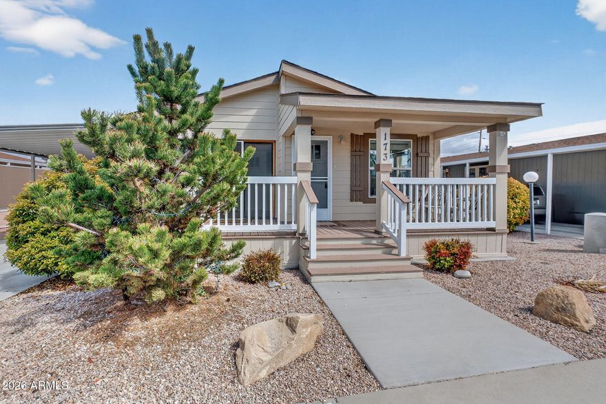 This 2017 double-wide mobile home offers a modern, open-concept living space designed for comfort, durability, and entertaining. Featuring fresh exterior paint, this home boasts significant outdoor living spaces, including extensive decking and covered porches, alongside large fenced-in areas perfect for privacy or pets. If you are looking for a ''move-in ready'' home with no deferred maintenance then look no further. The kitchen is equipped with relatively new upgraded GE appliances featuring a kitchen island, ample cabinet storage and a Pantry. The glass sliding door leads to the fenced in patio area under the carport which makes a great covered outdoor area for your grill and al fresco Dining.  Community is age restricted - 55+ There is a versatile Bedroom/Office with a separate exterior entrance, making it an ideal, private home office or guest suite. The Primary Suite is light and bright with a large walk-in closet and an en-suite 3/4 bathroom featuring built-in storage. The other bedroom is spacious with a walk in closet and vaulted ceiling too. An extra-large laundry room provides additional utility and storage space in addition to the attached Shed at the rear of the 2-Car Tandem Carport. Situated on an oversized mostly fenced in lot featuring so many patios and deck areas making the home perfect for year-round entertaining. The low-maintenance, fenced-in yard is a great spot for your dog or potted gardening and additional outdoor living. This home redefines manufactured housing with high-end, site-built style finishes and unmatched convenience. The 55+ active community offers premier amenities and planned social activities. The Current Monthly Lot Lease of $528.70 includes your water, sewer and trash along with the community amenities/activities. There is no separate HOA. All Buyers must apply and be approved by the Park. Only 1 dog per residence and breed must be on insurance approved list. This Community has RV Parking Available to Rent for your RV. Buyers to verify all information provided in MLS.