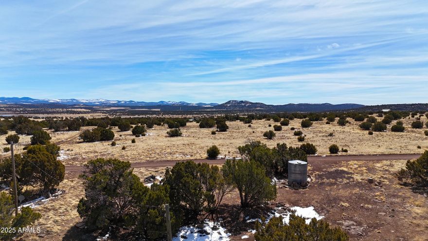 Great location with Mountain View's.  Discover the potential of this 2.18 acre  corner lot, ideally situated for those looking to build or place a manufactured home and also room for your RV. This property comes equipped with essential utilities, including a 200 amp electrical service conveniently located in the middle of the land, supported by its own power pole. A couple standout features include a permitted septic and a 2800-gallon galvanized water tank for either hauled water or to have to water delivered. Whether you're considering permanent residency or a recreational retreat, this lot is RV acceptable, offering flexibility for various lifestyles. This listing also includes Parcel 107-15-463. With ample space to explore and enjoy, you can create the perfect outdoor oasis while enjoying the peace and tranquility of the surrounding area.
Don't miss out on this incredible opportunity to own a slice of land that can fulfill your vision. Your dream property awaits!