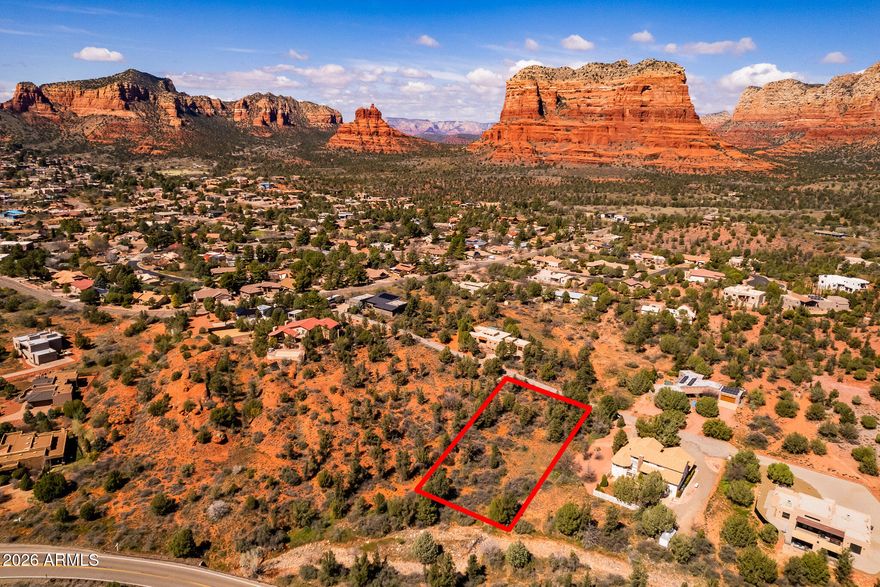 Rare 1-acre Sedona homesite with red rock views in the coveted Pinon Valley neighborhood. Surrounded by native high-desert vegetation, this beautiful lot offers the perfect canvas for your custom Sedona retreat. The gently sloping terrain provides ideal building opportunities while maintaining privacy and natural character. Nestled among established luxury homes on a paved cul-de-sac drive with no HOA. Utilities at lot ready for connection. Iconic views of Courthouse Butte deliver the quintessential Sedona living experience. Here's a serene, tucked-away homesite just minutes from Sedona's world-class hiking trails, shopping, restaurants, art galleries, and outdoor adventures. Whether you're dreaming of a luxury getaway, a full-time residence, or an investment build, opportunities like this are becoming increasingly rare. Experience the magic of Sedona and envision your dream home on this stunning piece of Arizona land!