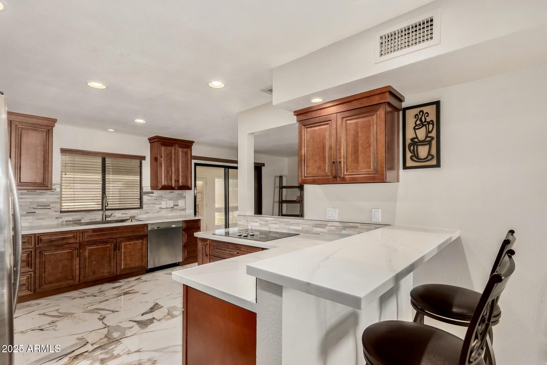 7729 E HARVARD Street