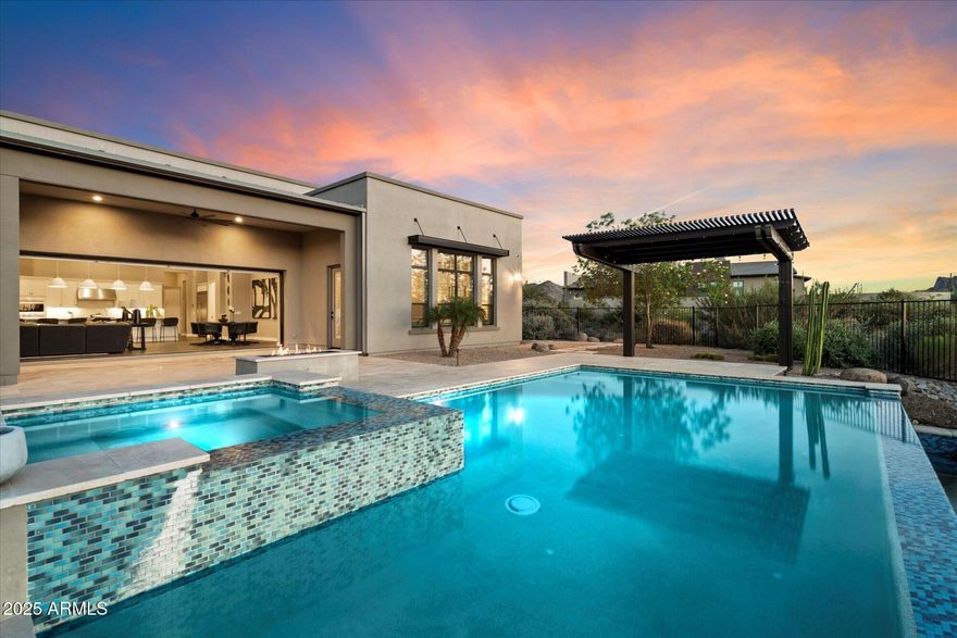 Listing includes additional 1.7 Acre NO HOA parcel, totaling 3.15 Acres of desert serenity! Set against the dramatic backdrop of Troon Mountain, this 4,309 sq ft home offers an inspired fusion of contemporary luxury and unobstructed mountain views, within the exclusive gates of Boulder Ranch. A true dual primary floor plan, each primary suite features a spa-like bathroom, while the attached casita is ideal for guests. Perfect for seamless indoor-outdoor entertaining, the open-concept kitchen flows into the expansive great room, opening to a stunning backyard oasis - with heated pool and spa, fire feature, and misting system. Proximity to world-class dining, shopping, golf, and outdoor recreation. Inquire today!
