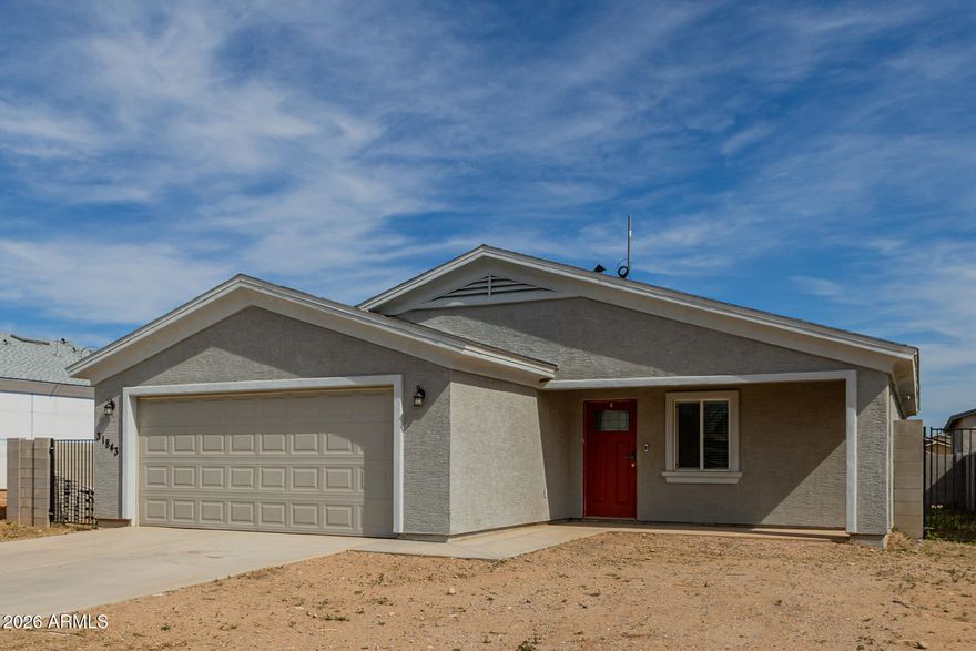 Built in 2023, this modern 3-bedroom, 2-bath home offers the space and freedom buyers love in Wittmann -- with NO HOA. The open-concept layout features tile flooring throughout and a stylish kitchen with sleek finishes and ample cabinet space. Spacious living and dining areas create an inviting space for everyday living or entertaining. The private primary suite includes a well-appointed bath and generous closet space. Outside, enjoy a block-fenced backyard with an RV gate and extra parking. Move-in ready with energy-efficient construction and modern upgrades throughout.