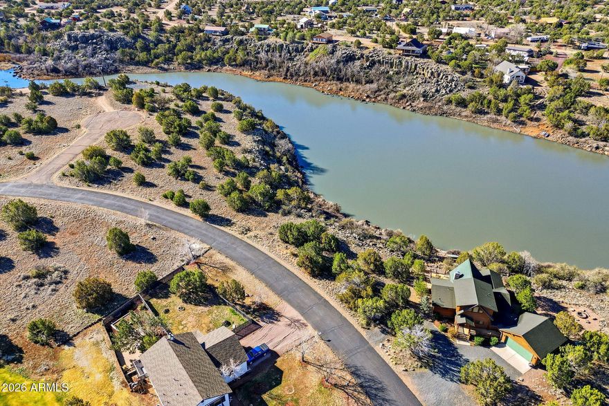 Prime Waterfront Opportunity - 
Nestled directly on the serene, private shores of White Mountain Lake, this rare nearly half-acre parcel is the sole waterfront lot available in this sought-after area. Enjoy direct lake access for boating, world-class fishing, water skiing, jet skiing, kayaking, and more--no restrictions on horsepower!
Utilities are ready and waiting: electric, water, and sewer already on the property. Lake rights are conveyed before you even break ground, so you can start planning your dream lakefront home right away.
Located in the desirable, gated Eaglescrest community for added privacy and security. Just minutes from Show Low and Snowflake, offering convenient access to shopping, dining, amenities, and the stunning White Mountains lifestyle. Plus, you're perfectly positioned for golf enthusiasts--top-rated courses like Birdie Ranch right nearby, with other championship options (including Bison Golf Club, Torreon, and more) just a short drive away for year-round play in the White Mountains
Flexible seller financing available with a substantial down payment--making this exceptional property even more accessible for the right buyer.
This one-of-a-kind waterfront gem is a true rarity -- don't miss your chance to own your piece of paradise on White Mountain Lake!