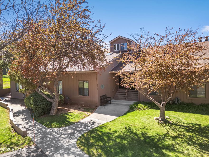 Situated on the 9th green of Continental Country Club, this well-appointed 2-bedroom, 2-bath townhouse offers exceptional golf course living and premium amenities. Perfectly positioned just steps from The Oakmont restaurant, enjoy easy access to dining, clubhouse and golf amenities, pool, and much more - right from your doorstep. Inside, this home features a spacious layout, with a versatile upstairs loft - ideal for a home office, guest overflow, or additional living space. The floor-to-ceiling windows capture sweeping views of the 9th hole, pine trees and blue sky. Whether you're looking for a full-time residence, vacation getaway, or lock-and-leave investment property, this home delivers amazing location, scenic surroundings, and access to one of Flagstaff's most desirable communities.