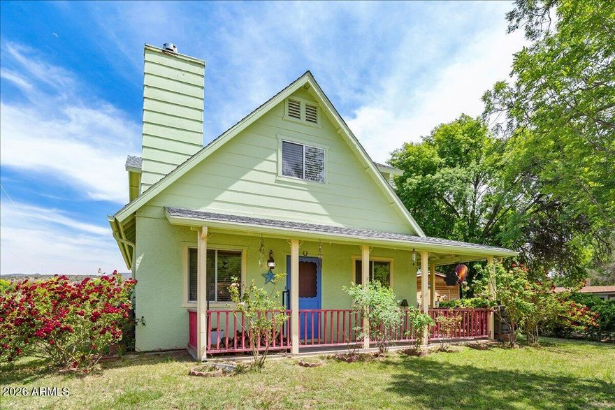Cottage-style home on nearly 1/4 acre featuring two climate-controlled outbuildings and flexible living space. Cozy wood stove and warm, inviting interiors create a welcoming feel throughout. Main living areas are conveniently located on one level, along with a versatile downstairs bedroom featuring patio access and direct entry to the bathroom.
Upstairs offers two additional bedrooms, including a spacious primary bedroom and guest room. The country kitchen opens to the dining and living areas, providing an easy flow for everyday living and entertaining.
Enjoy the added value of two separate climate-controlled outbuildings--a detached studio with mini-split A/C and a workshop with HVAC--ideal for hobbies, remote work, or creative space. The fully fenced yard features covered patios, grassy areas, mature shade trees, and blooming rose bushes, with plenty of parking. Located directly across from a beautiful tree-lined park with pond, adding to the peaceful setting.