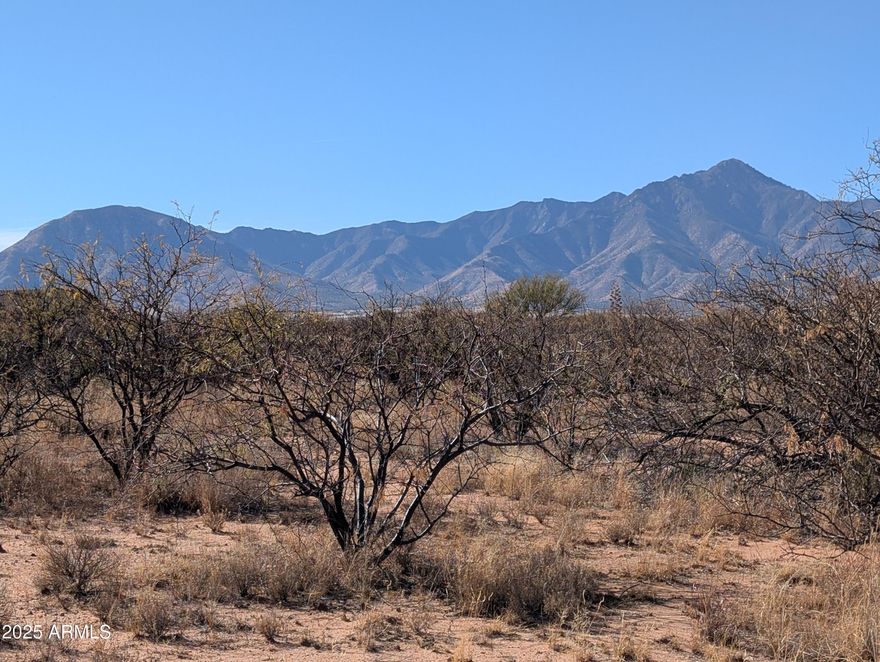 Welcome home to your 20 acres of Arizona sunsets and mountain views in a gated community with site-built homes only. Power at the lot line and backing to a wash on the northwest corner. Flat portion for easy building. Own your piece of the old west with incredible views, high-speed internet, power, and tranquil star-filled nights. Seller willing to divide into two smaller parcels.