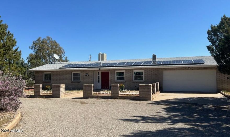Country Living at it's finest! Located on over an acre on a paved road, this great home has Mountain Views, New Flooring & Interior Paint, Solar AND a Private Well! PLUS, VA 2.5% Assumable Loan available on the remainder of the mortgage!  Large storage building, fenced backyard, raised garden area plus a 2-car garage. This home boasts a spacious kitchen with plenty of cabinet space and 2 pantry closets, a HUGE Laundry Room with a utility sink, extra counter space and a 1/4 bath nearby. A cute 1bd/1ba guest house sits on the back side of this property with it's own private drive. Perfect to rent or to give you a little extra space! NO HOA! Room to park your RV. Invite family and friends and enjoy entertaining on the large covered back patio!