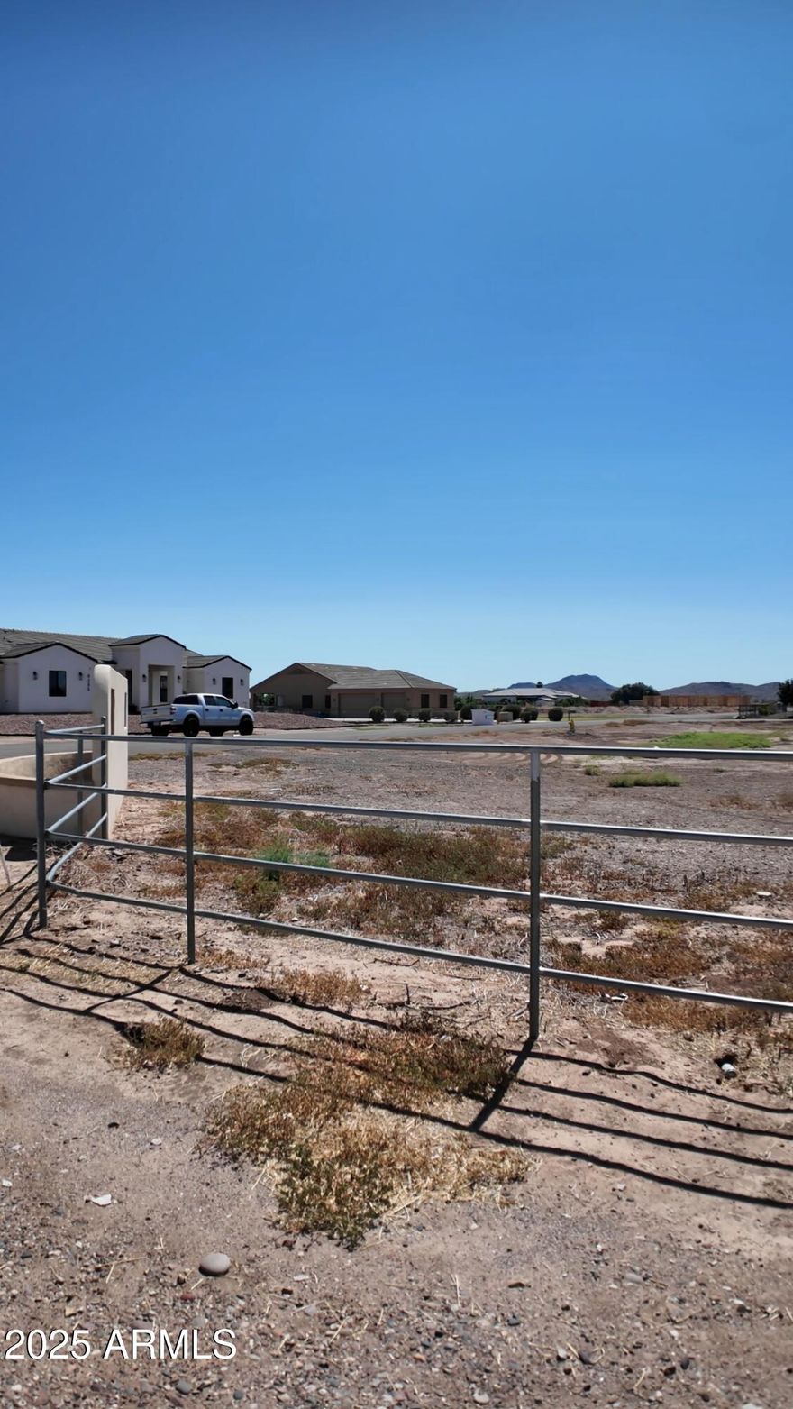 Rare 1-acre cul-de-sac corner lot in White Fence Farms! This prime parcel offers no building restrictions, paved city roads, Irrigation rights, and power and light near the lot line. Surrounded by million-dollar custom homes, it boasts breathtaking mountain views and ideal north-south exposure--perfect for building your dream property. Property is half fenced and horses are allowed ..