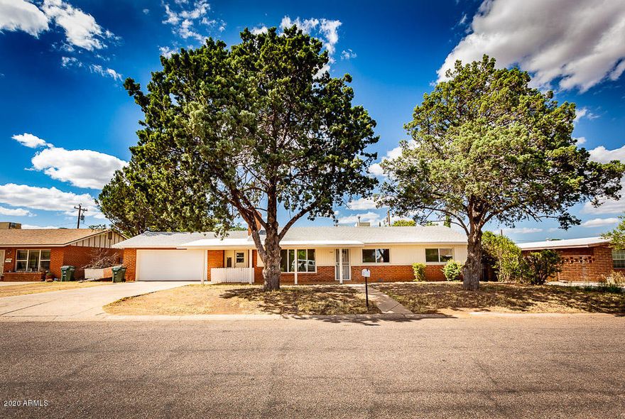 Live in the heart of town in this lovely home. 3 bedroom, 2 bath, 2 car garage (unique to this neighborhood) and large lot. Kitchen is waiting for your special touch. Whole house is tile - no carpet to maintain! Master en-suite completely remodeled and expanded to utilize space to the best ability. Great home waiting for the next owner.