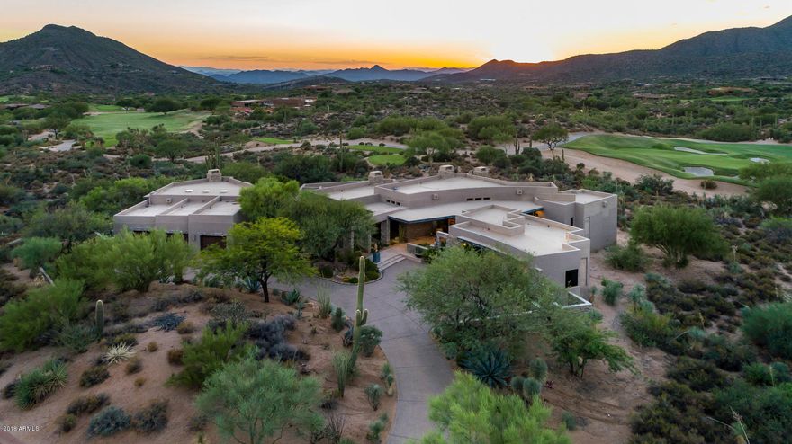 Welcome to one of the best locations in the community of Desert Mountain, North Scottsdale AZ.  The Village of Deer Run is situated between the Sonoran Fitness Center and the Cochise/ Geronimo Clubhouse. Walking distance to both. This home has views in every direction! Majestic mountains, Arizona sunsets, Golf course, south /west orientation, Twinkling Lights and Privacy! 
1.6 acres of natural area & open spaces.
5063 square feet of an open concept designed home.  This exquisite home features four bedroom suites. Formal dining area with bar and wine room. 									This is the home to enjoy your Arizona Lifestyle !