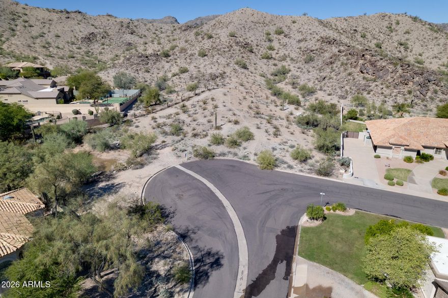 Hillside lot on preservation in prestigious Ahwatukee Custom Estates. Step out into the mountains once you build your dream home on this lot. Almost one acre, 42,253 sq. feet 4.5 miles to nearest interstate, for an easy commute all over the valley or the Phoenix airport. Owner/Agent are active Arizona licensed real estate agents.
