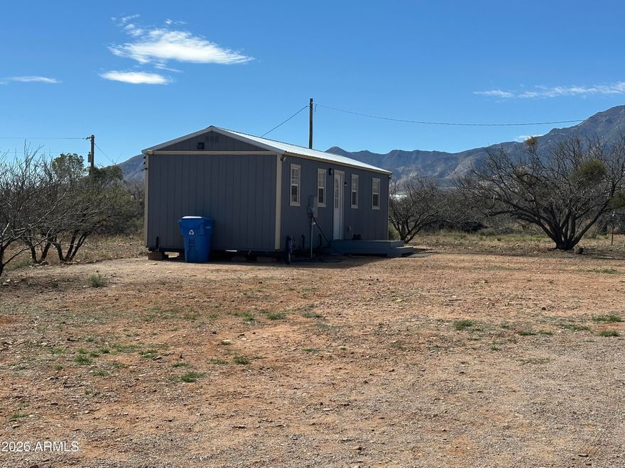 You will love this little dollhouse! It is super cute!. You will love the easy care tile flooring throughout. The bedroom is a good size and has a barn door at the entry. On the opposite side there is another barn door with storage on the inside where the bathroom and laundry are located. The property is fully fenced and there is an RV pad and hookup. There is also a detached 2 car garage/workshop and a chicken coop area. It you need a larger home, the addjaqcent property at 5751 Red Tail mls# 6951928 is also available. Do Not miss this great opportunity, The address is also known as 5750 S Kino Rd.