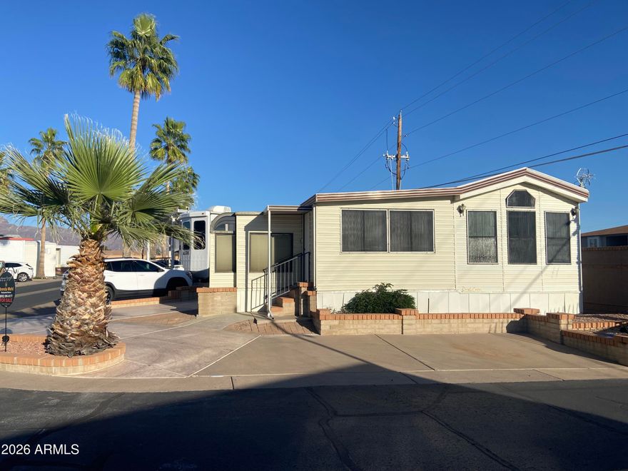 1987 mobile with Arizona room addition. 2 bathrooms, 1 bedroom with inside laundry. Handy-man special sold ''as is'' or can be removed from lot and reclaimed as an RV lot or can be built out with a new park model with addition. Great corner lot location close to the golf course, on-site restaurant pools and endless resort activities. 55+ Golf Course Resort