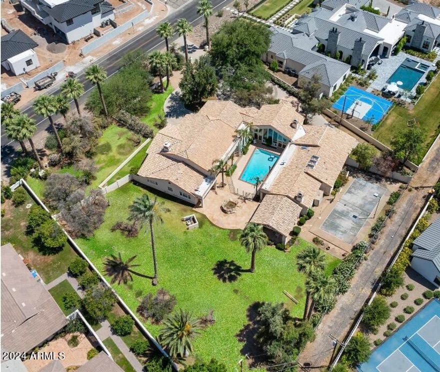 Huge lot on one of Arcadia's most beautiful streets. Amazing views of Camelback Mountain. There is a home currently on the site which faces south with views to the north.

Buyer to verify all facts and figures.