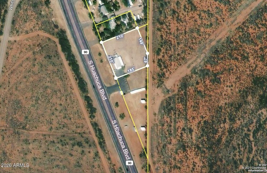 451.9' of Frontage on hwy 90! Last parcel within the city limits. Completely fenced in total of three parcels. They include 106-57-021, 106-57-022, 106-57-029. Well, septic, propane and electric all included. Unaffixed 1996. Manufactured home, with 4 offices, 2 ba (one ADA compliant), kitchen and covered porches off front and back. AC included.  Newer flooring. Newer metal roof, storage shed, 10 space paved parking. Ready for your vision.