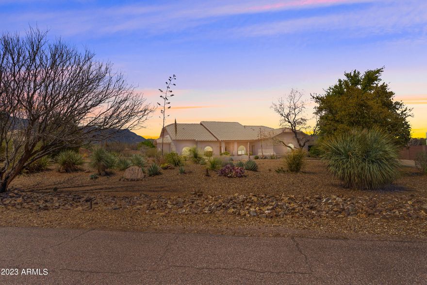 Welcome home! Come enjoy the beautiful views and spacious surroundings at this beautiful home in Mountain Shadows subdivision. Inside this beautiful home you will will find 3 bedrooms and 2 bathrooms in a split floor plan. Primary bedroom and on suite on 1 side of the home and additional bedrooms on opposite end of the home. You also have 2 living spaces, eat in dining area, formal dining room and kitchen centrally located with a see through fire place to living room and eat in dining area. 2 car garage also has additional storage room. Out back you can enjoy your amazing views from a large patio. Additional building was an observatory with a roll back roof and office/storage. Open backyard allows for all of our unique AZ wildlife to pass through for your viewing. Come see this one today!