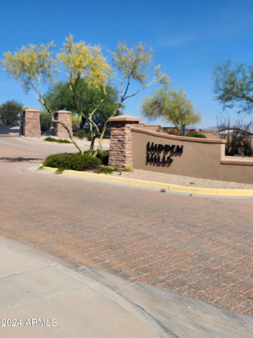 Custom Home Lot for Sale. This very special lot, located in the Hidden Hills gated community, is just a short walk away from the Starpointe Residence Club, Safeway shopping center, the Estrella Lakes and all of the other amenities of Estrella. Yet, it feels like it's a million miles away on the other side of the mountain. 
This lot is one of the premiere lots in all of Estrella. It is elevated with an unsurpassed view of the White Tank Mountains, Central Valley and the Estrella Mountains. The lot is 1.07 acres and surrounded by desert preserves which allows you to build your forever home on the side of your own private mountain.  To view renderings of your future home on this lot click on the ''More'' tab. This lot would allow you to build an incredible multi-level custom home in Estrella. To see pictures of the lot and future home renderings, view MLS 6887765 or the attached pictures.
Buyer has the right to choose all interior finishes and the exterior elevation design (exterior elevation design contingent on HOA review and approval). The main floor is 3,004 square feet and the lower floor guest quarters / mother-in-law suite is 1,150 square feet, for a total of 4,154 square feet. The home includes a four-car garage, swimming pool, spa and outdoor kitchen. This home features a captivating great room floor plan and is situated on a gorgeous 1.07-acre lot providing the perfect canvas for your vision of luxury living. This remarkable residence promises an unparalleled level of customization and sophistication.